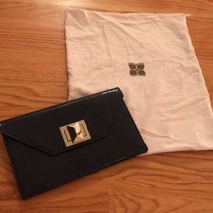 Navy snake skin bcbg clutch